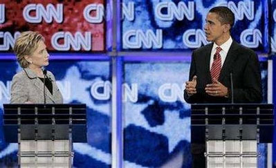 Senator Barack Obama (D-IL) (R) gestures as Senator Hillary ...