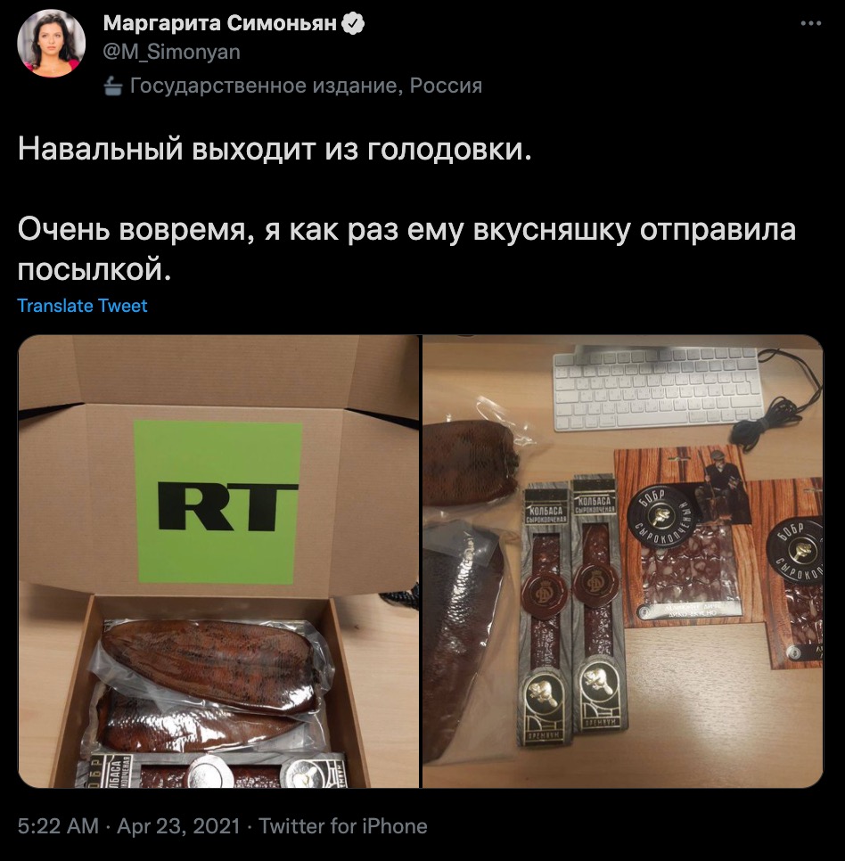 Simonyan tweet in Russian with images of smoked sausages in a cardboard box