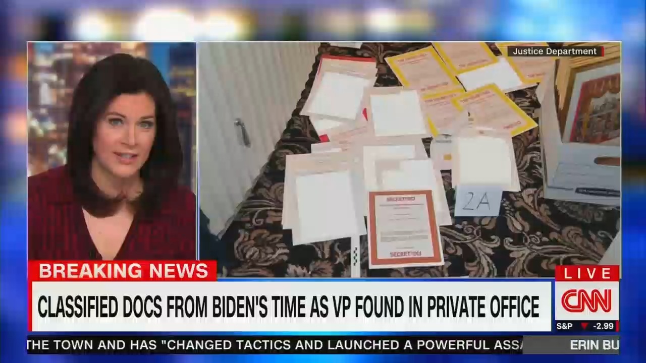 Erin Burnett alongside a photo of classified documents from Mar-a-Lago; the chyron reads "CLASSIFIED DOCS FROM BIDEN'S TIME AS VP FOUND IN PRIVATE OFFICE"