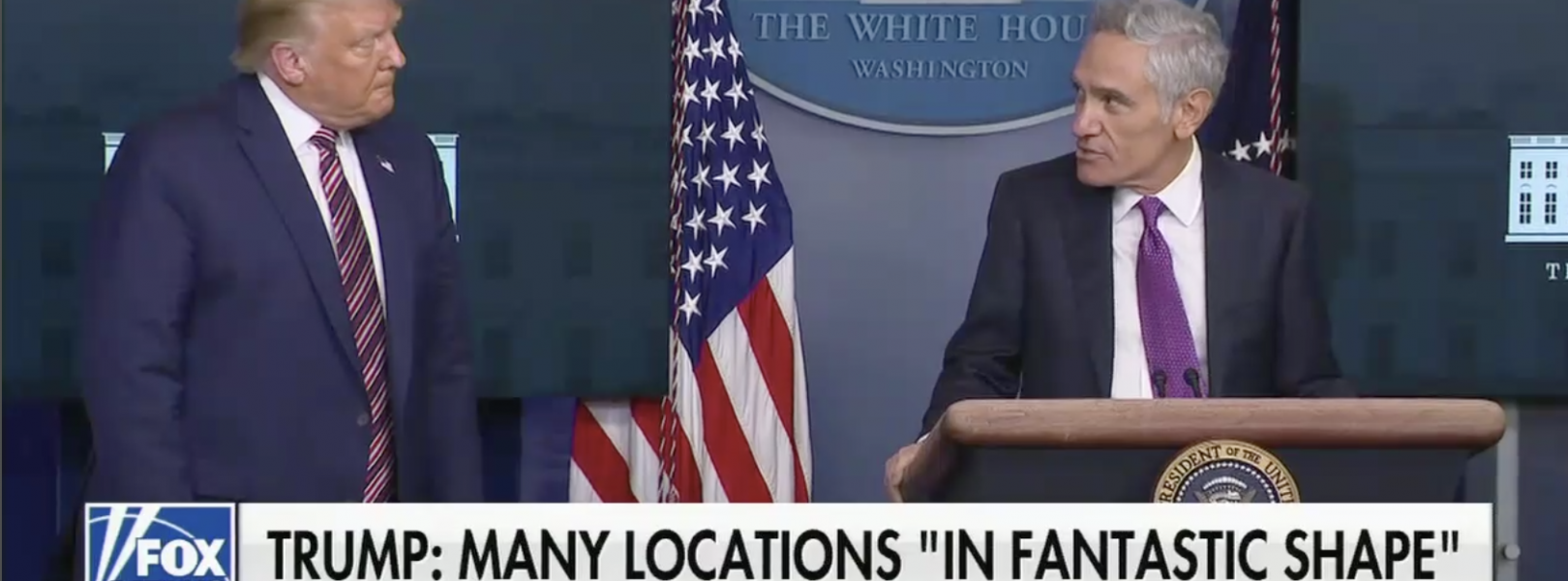 Scott Atlas appears at an August 12 White House press briefing with President Trump