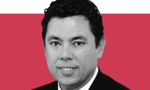 Black and white photo of Jason Chaffetz on a red background
