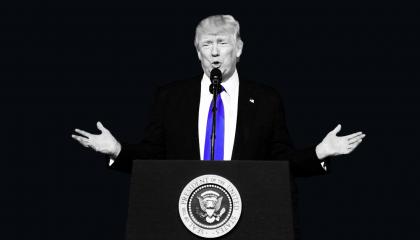 Donald Trump standing behind the presidential seal, with a black background