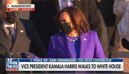 Live shot of Kamala Harris in purple suit walking with her family 