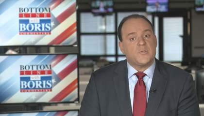 Boris Epshteyn narrating his segment in front of a screen that says "Bottom Line With Boris"