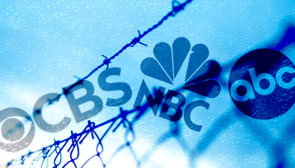 Border fence with broadcast network logos