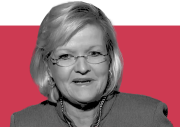 cleta mitchell in front of a red background