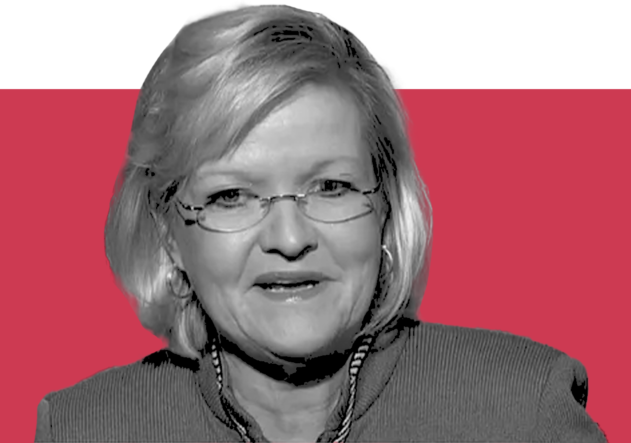cleta mitchell in front of a red background